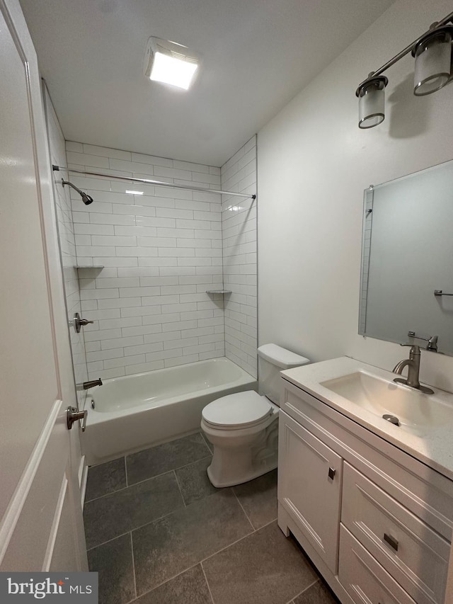 full bathroom with vanity, toilet, and tiled shower / bath combo