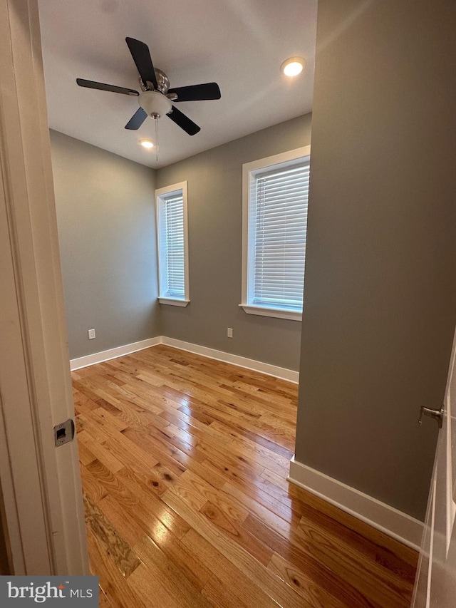 spare room featuring ceiling fan and light hardwood / wood-style floors