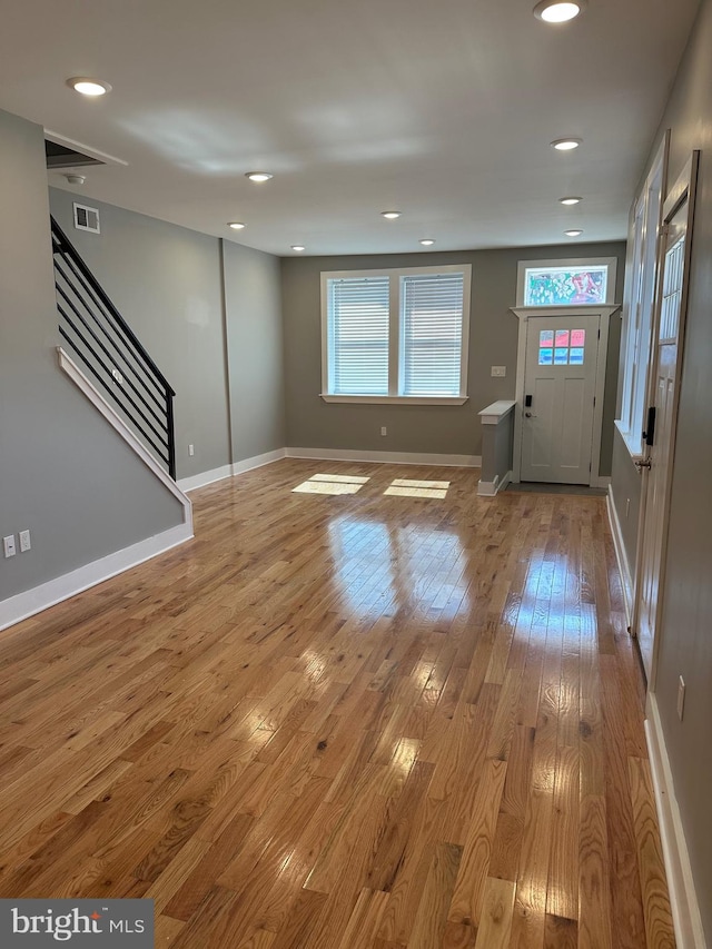 unfurnished living room featuring light hardwood / wood-style flooring