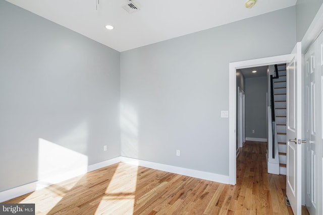 empty room featuring hardwood / wood-style flooring