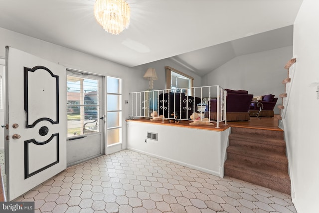 entrance foyer with lofted ceiling