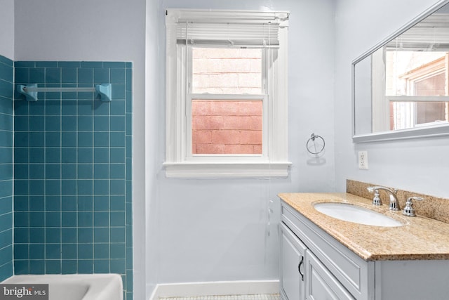 bathroom featuring plenty of natural light, tile patterned floors, and vanity