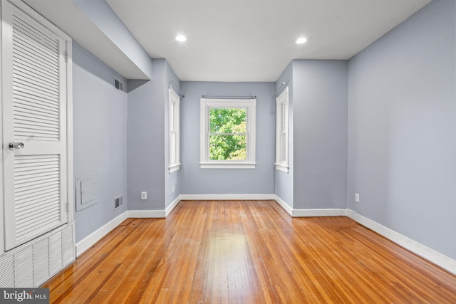 unfurnished bedroom with light wood-type flooring