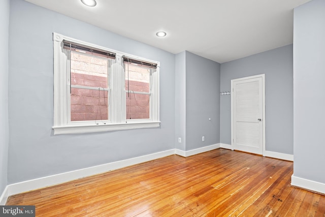 spare room featuring hardwood / wood-style floors