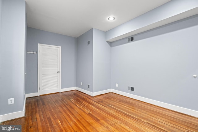 unfurnished room featuring hardwood / wood-style floors