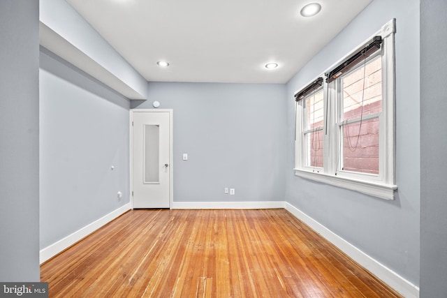 unfurnished room with light wood-type flooring