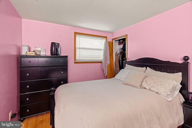 bedroom featuring light hardwood / wood-style flooring and a closet