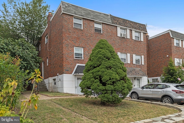 view of home's exterior with cooling unit and a yard