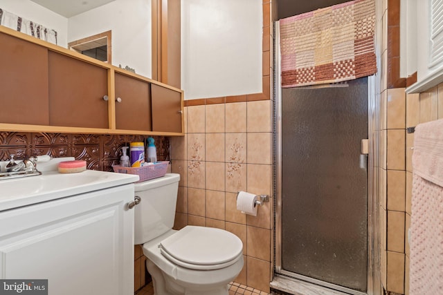 bathroom featuring tile walls, a shower with shower door, vanity, and toilet