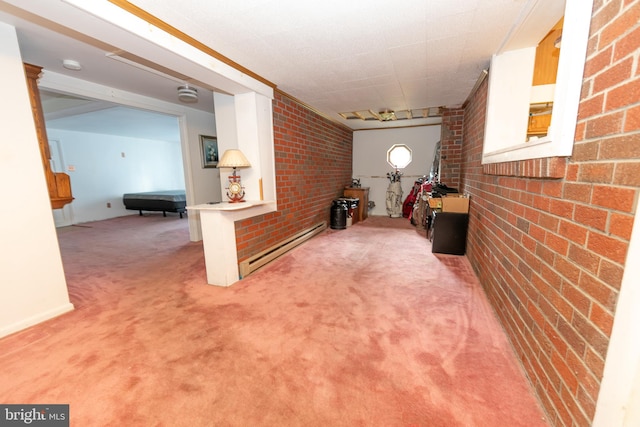 corridor featuring brick wall, carpet flooring, and a baseboard heating unit