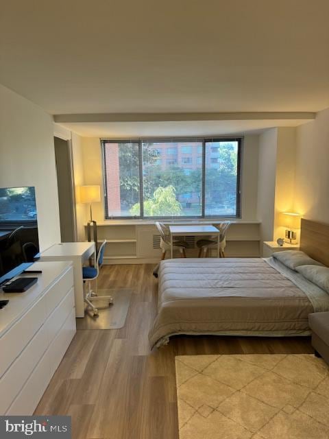 bedroom with light wood-type flooring