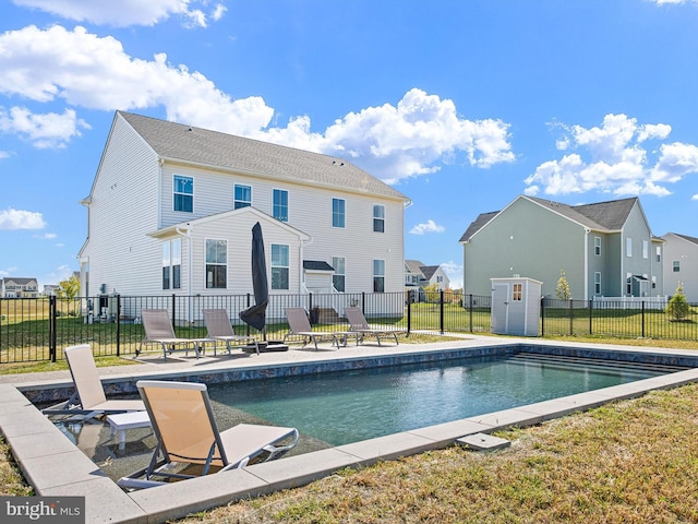 view of swimming pool featuring a yard and a patio area