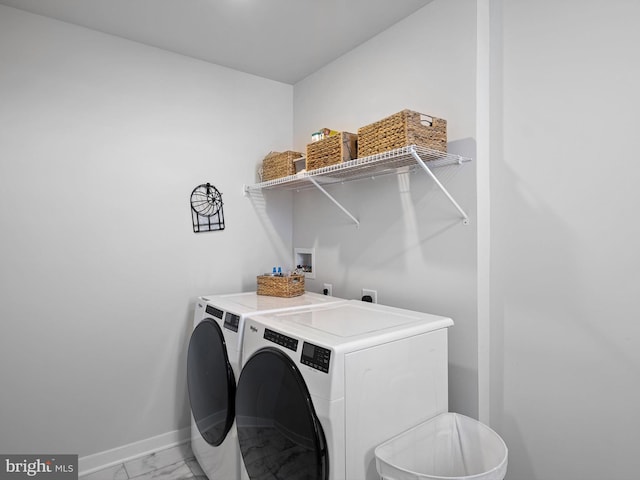 laundry room featuring separate washer and dryer