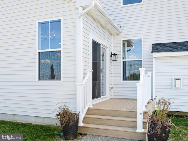 property entrance with a wooden deck