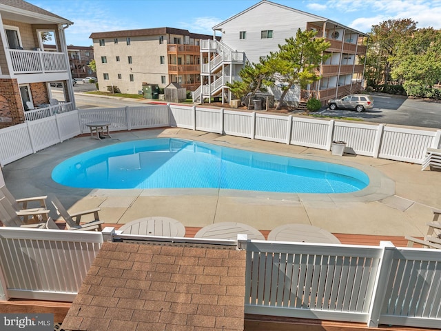 view of swimming pool with a patio