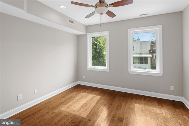 spare room featuring ceiling fan and hardwood / wood-style flooring