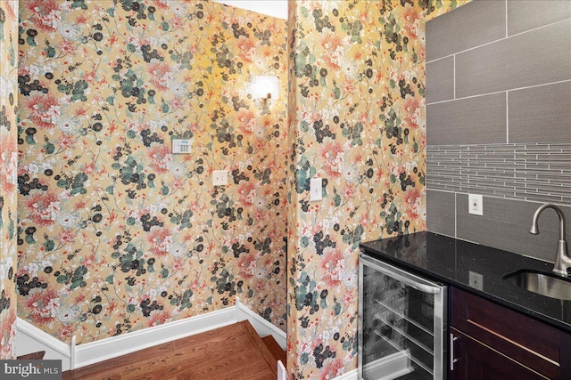 bathroom with vanity, beverage cooler, and hardwood / wood-style floors