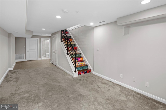 basement with light colored carpet