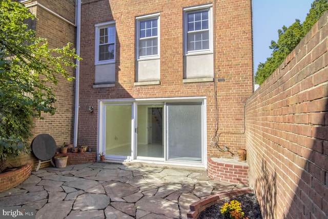 rear view of house with a patio