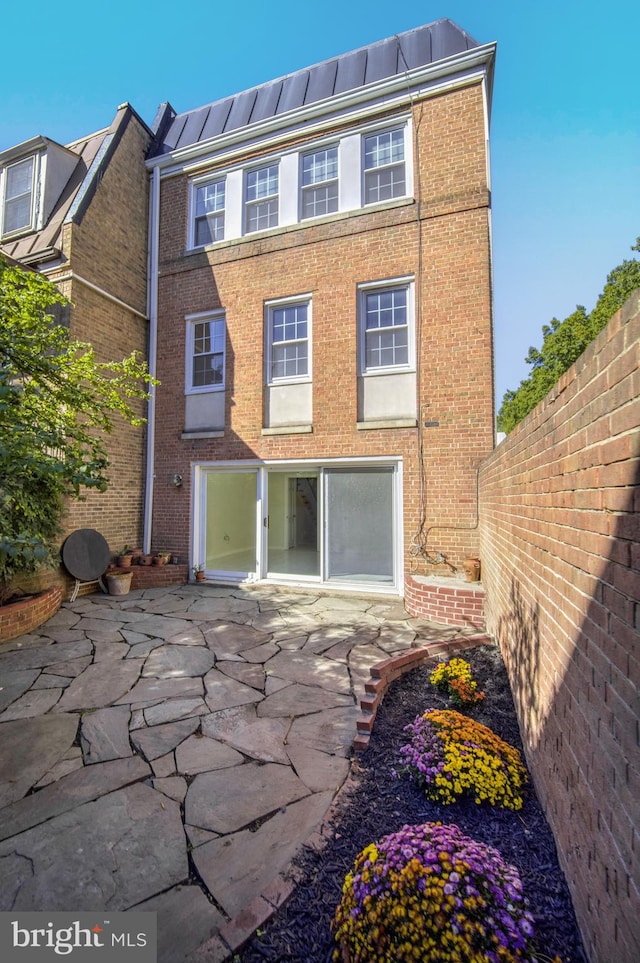 back of property with a patio area