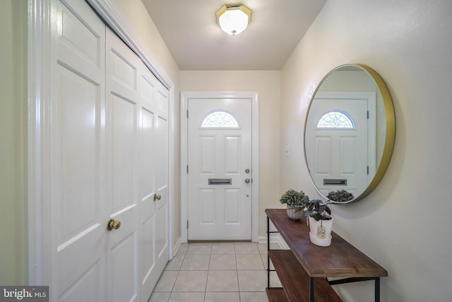 doorway featuring light tile patterned floors