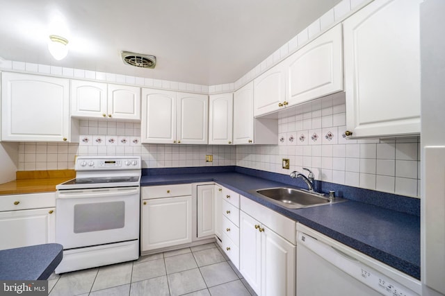 kitchen featuring white cabinets, white appliances, and sink