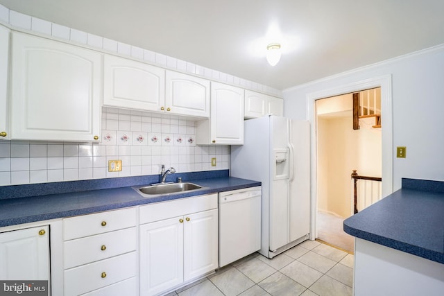 kitchen with white appliances, white cabinets, sink, light tile patterned floors, and ornamental molding