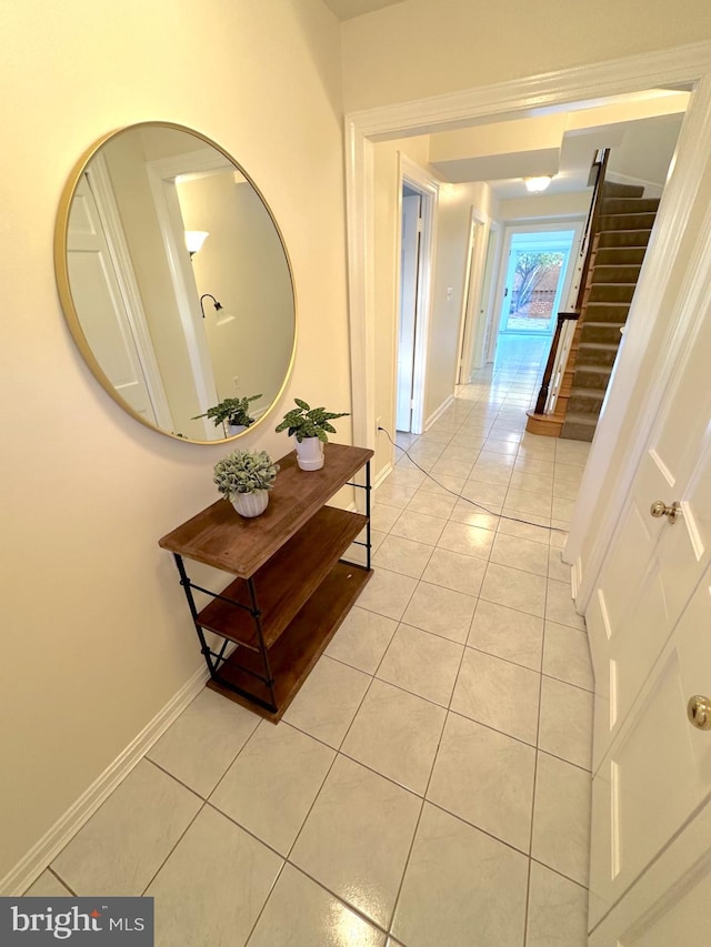 hallway featuring light tile patterned flooring