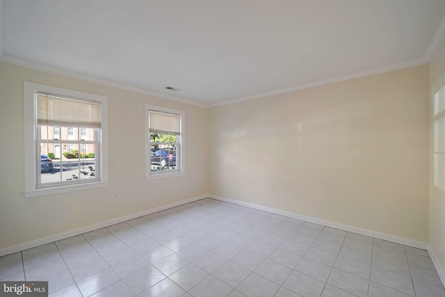 tiled spare room with ornamental molding