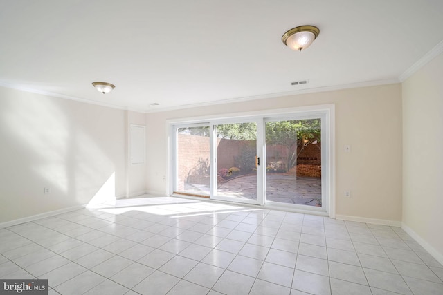 tiled spare room with crown molding