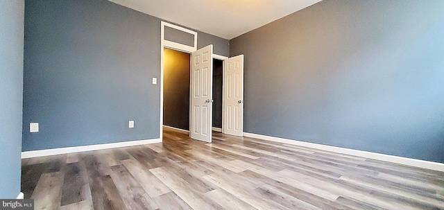 unfurnished bedroom featuring light wood-type flooring