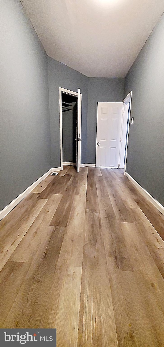 unfurnished bedroom featuring wood-type flooring