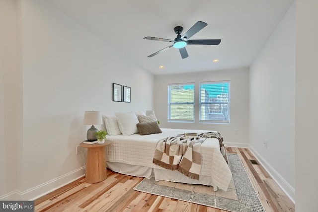 bedroom featuring wood-type flooring and ceiling fan