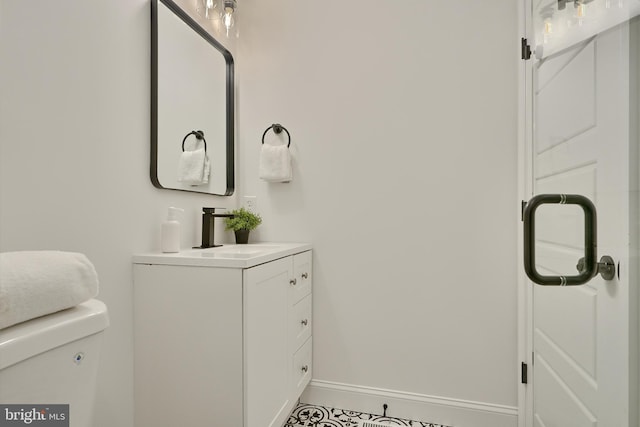 bathroom featuring vanity and toilet