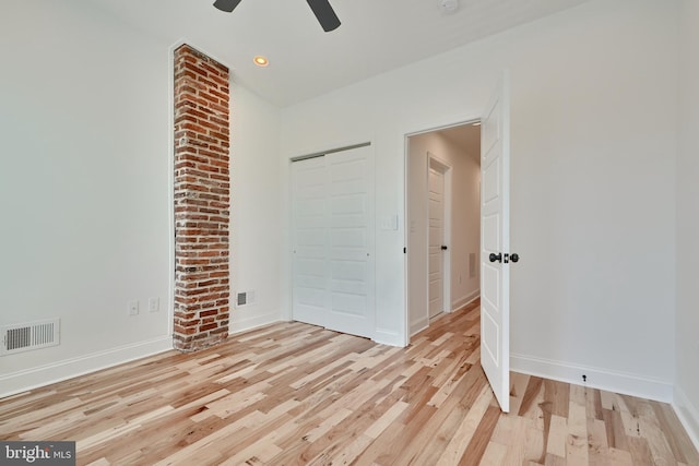 spare room featuring light hardwood / wood-style floors and ceiling fan