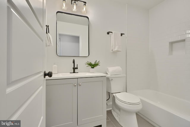 full bathroom featuring vanity, toilet, tile patterned floors, and washtub / shower combination