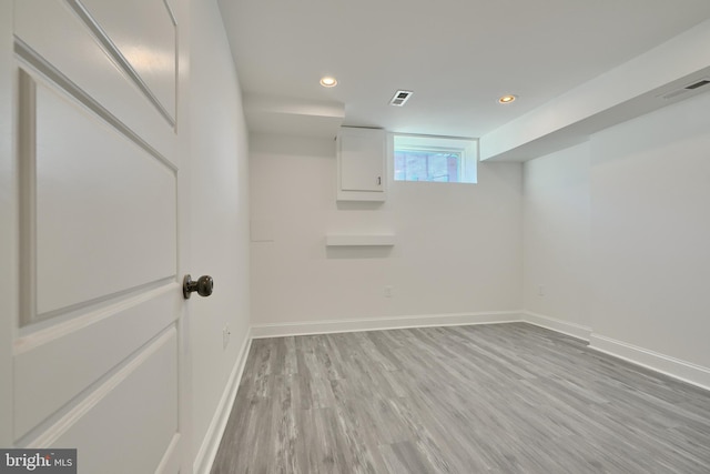 basement with light wood-type flooring