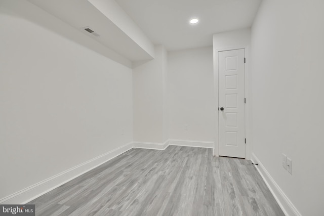 spare room featuring light hardwood / wood-style floors