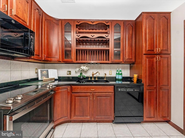 kitchen with black appliances, decorative backsplash, light tile patterned floors, and sink