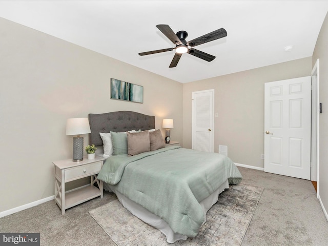 bedroom with ceiling fan and light colored carpet