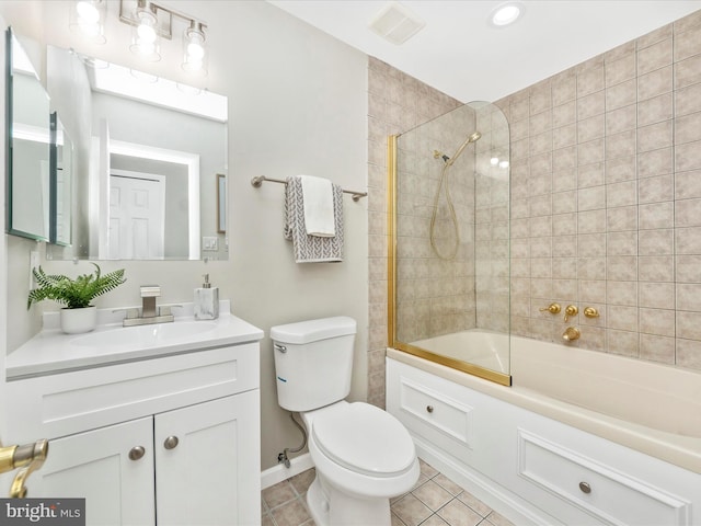 full bathroom with combined bath / shower with glass door, vanity, toilet, and tile patterned flooring