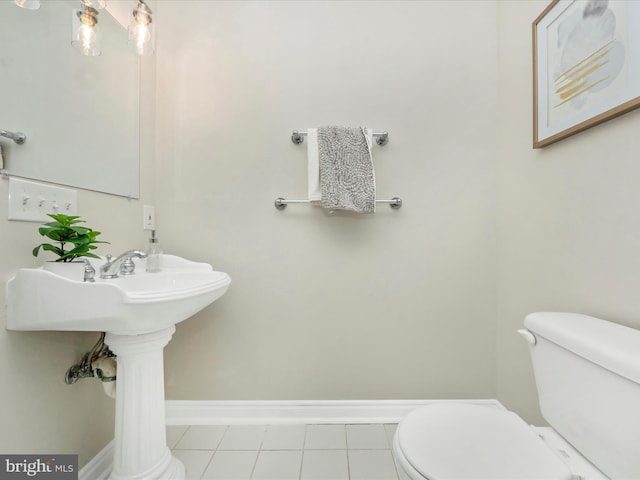 bathroom featuring tile patterned flooring and toilet