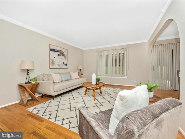 living room with light hardwood / wood-style floors and ornamental molding