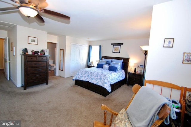 bedroom with a closet, light colored carpet, and ceiling fan