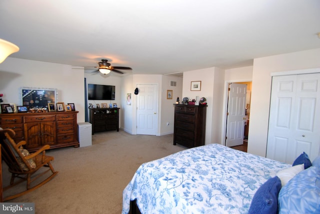 carpeted bedroom with ceiling fan