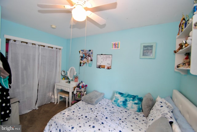 carpeted bedroom featuring ceiling fan