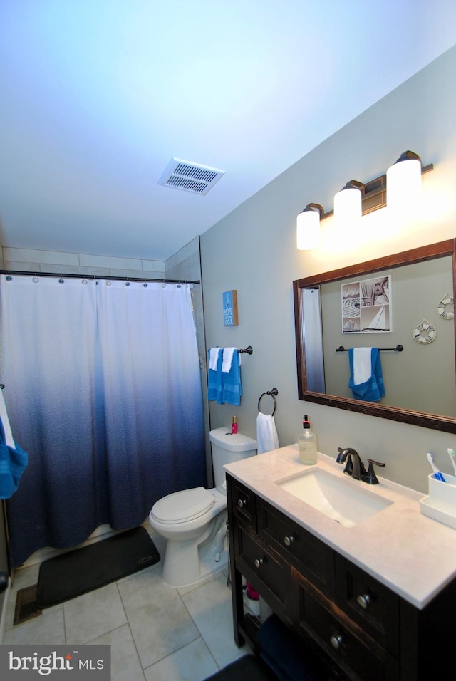 bathroom featuring tile patterned flooring, a shower with shower curtain, vanity, and toilet