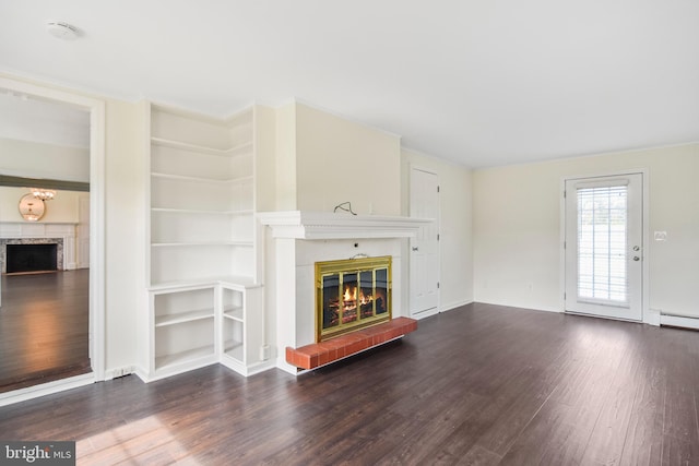 333 Carter Rd, Princeton, NJ 08540 - unfurnished living room with a glass covered fireplace, wood finished floors, a baseboard radiator, and built in shelves