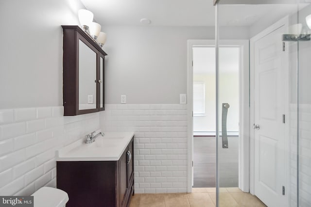 333 Carter Rd, Princeton, NJ 08540 - bathroom featuring tile walls, vanity, tile patterned flooring, a wainscoted wall, and a baseboard radiator