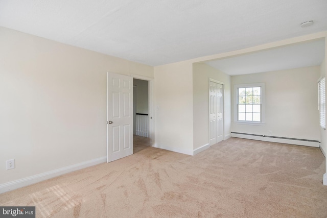 333 Carter Rd, Princeton, NJ 08540 - carpeted spare room with a baseboard heating unit and a smoke detector